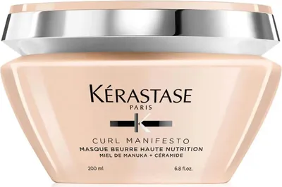 A front view of a Kérastase Curl Manifesto hair mask jar.