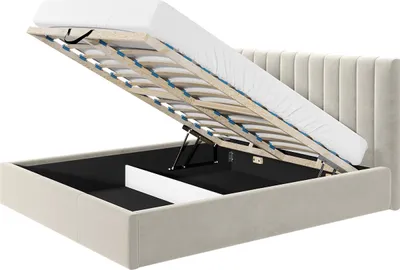 A beige upholstered bed frame with the mattress and slatted base lifted to reveal the storage compartment underneath.