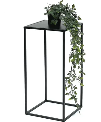 A black metal plant stand with a potted plant on top.