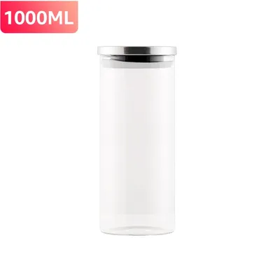 A clear studio shot of a glass storage jar with a silver lid.
