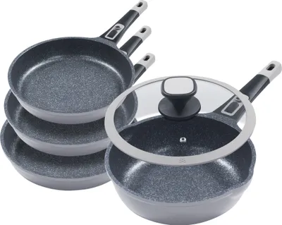 A set of frying pans and a wok with a lid, arranged on a white background.