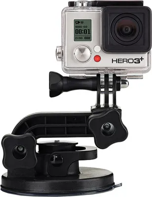 A GoPro camera mounted on a suction cup holder.