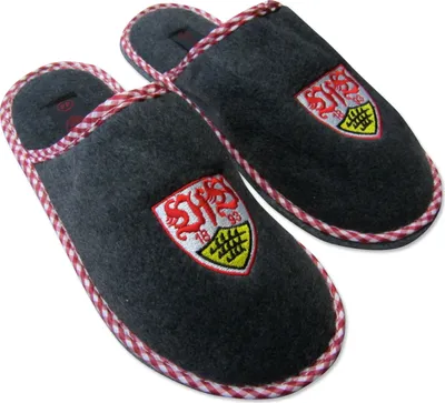 A pair of dark gray slippers with a checkered red and white trim, each featuring a shield-shaped logo embroidered on the front.