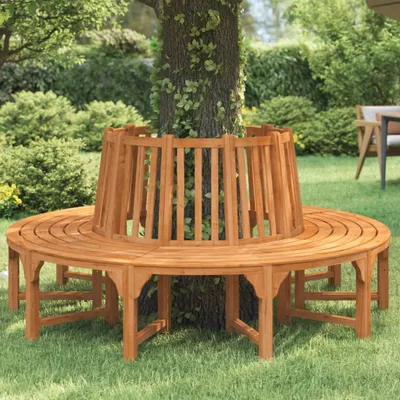 A wooden bench is placed around a tree in a garden.