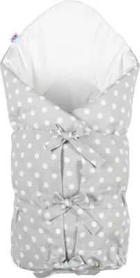 A baby swaddle with a polka dot pattern.