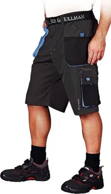 A person wearing work shorts and shoes.