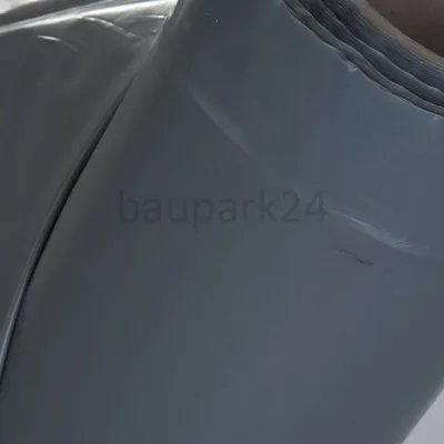 A close-up view of a roll of gray plastic sheeting, possibly construction film.