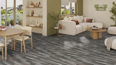 A modern living and dining area with a focus on the flooring.