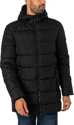 A man wearing a black puffer jacket.