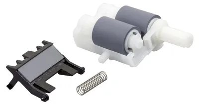 A paper feeding kit for a printer, consisting of rollers, a plastic bracket, and a spring, is displayed against a white background.