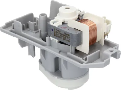 A close-up view of a washing machine condensate pump motor.