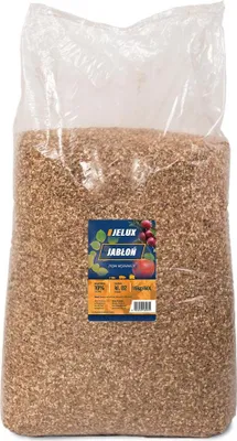 A large bag of wood chips, likely for smoking food, with a label showing fruit and brand information.