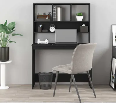A black desk with shelves and a chair in a room.
