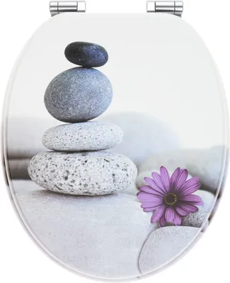 A toilet seat lid with a zen-like design of stacked stones and a purple flower.