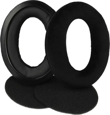 Two black headphone ear pads and two smaller black foam pieces are arranged on a white background.
