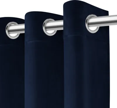 Close-up view of navy blue curtains with grommets on a silver curtain rod.