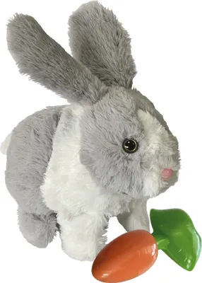 A plush toy rabbit with a carrot accessory against a white background.