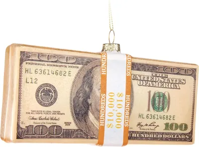 A close-up of a glass ornament shaped like a bundle of US dollar bills.