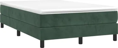 A green velvet box spring bed with black legs on a white background.
