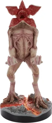 A figurine of a Demogorgon monster standing on a rocky, lava-like base.