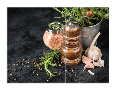 Produktbild von Wallario Herdabdeckplatte aus Glas, Größe 70 x 52 cm 2-teilig, Motiv Salz und Pfeffer mit Knoblauch und Rosmarin