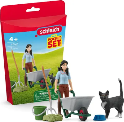 A Schleich Horse Club Pflegeset with Emily toy set, including figures, accessories, and packaging, displayed on a white background with a hint of green grass.