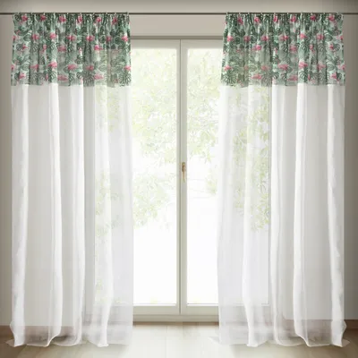 Two white sheer curtains with a decorative green and pink botanical patterned valance at the top, hanging in front of a window.