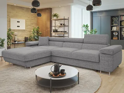 A modern living room with a large sectional sofa, coffee table, and shelving unit.