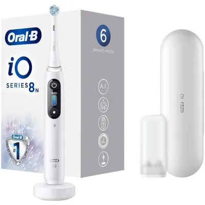A white Oral-B iO Series 8 electric toothbrush is displayed on its charging base, next to its packaging and a travel case.