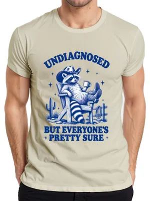 Productafbeelding van Undiagnosed, maar iedereen is er vrij zeker van: Wasbeer Cowboy, heren T-shirt, natuurprint, maat XXL