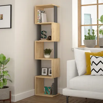 A modern bookshelf with decorative items and books, placed in a living room setting next to a sofa and a window.