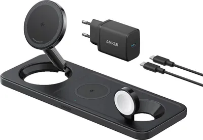 A black 3-in-1 wireless charging station with a detachable magnetic charger, a charging pad for a phone, and a charging spot for a smartwatch. It also includes a black Anker power adapter and two USB-C cables.