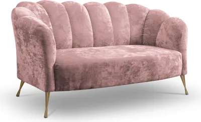 A pink velvet sofa with gold legs on a white background.