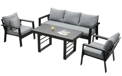 A patio furniture set consisting of a sofa, two chairs, and a coffee table, displayed on a white background.