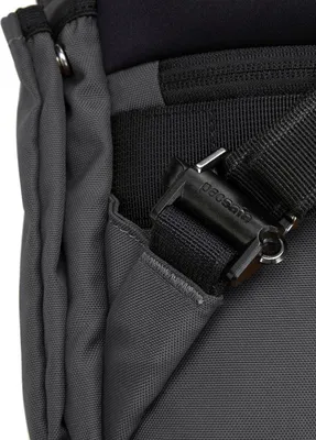A close-up view of a bag strap and buckle.