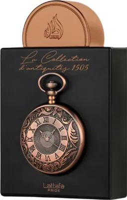 A black box with a pocket watch design and a gold cap on top.
