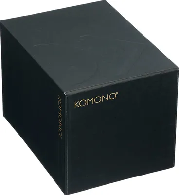 A black box with the brand name 'KOMONO' printed in gold.