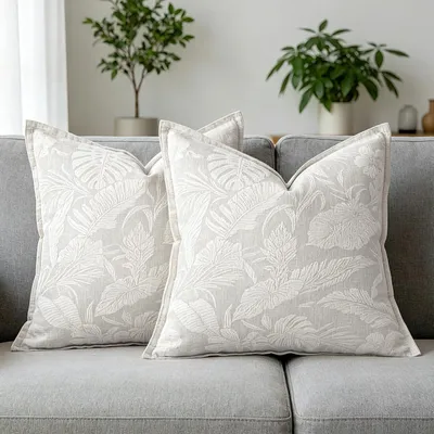 Immagine prodotto di Cuscini decorativi, set da 2, 45x45 cm, bianchi, motivo tropicale con foglie di palma, tessuto jacquard in chenille