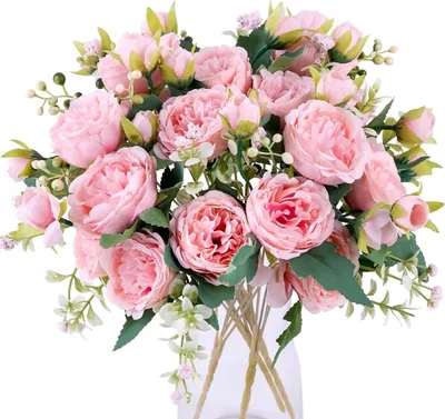 A bouquet of artificial pink peonies in a vase.