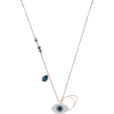 A close-up of a necklace with an evil eye pendant.