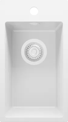 A top-down view of a white kitchen sink with a drain assembly.