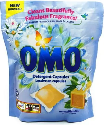 A pouch of OMO detergent capsules with a floral design.