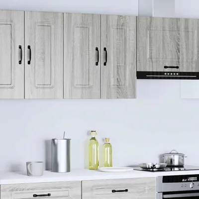 A kitchen scene with cabinets, countertop, and appliances.