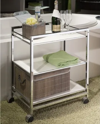 A bathroom or spa setting with a rolling cart holding toiletries and towels.