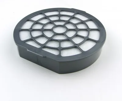A close-up, angled view of a black vacuum cleaner filter on a white background.
