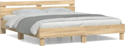 A wooden bed frame with a headboard and bedding, shown against a white background.