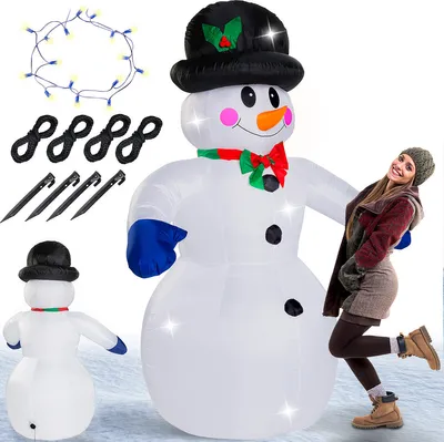 A large inflatable snowman with a woman posing next to it, with accessories for setup shown.
