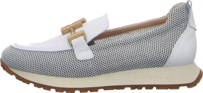 A side view of a single women's shoe.