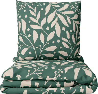 A folded duvet and pillow set with a floral pattern.