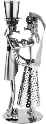 A metal sculpture of a bride and groom.